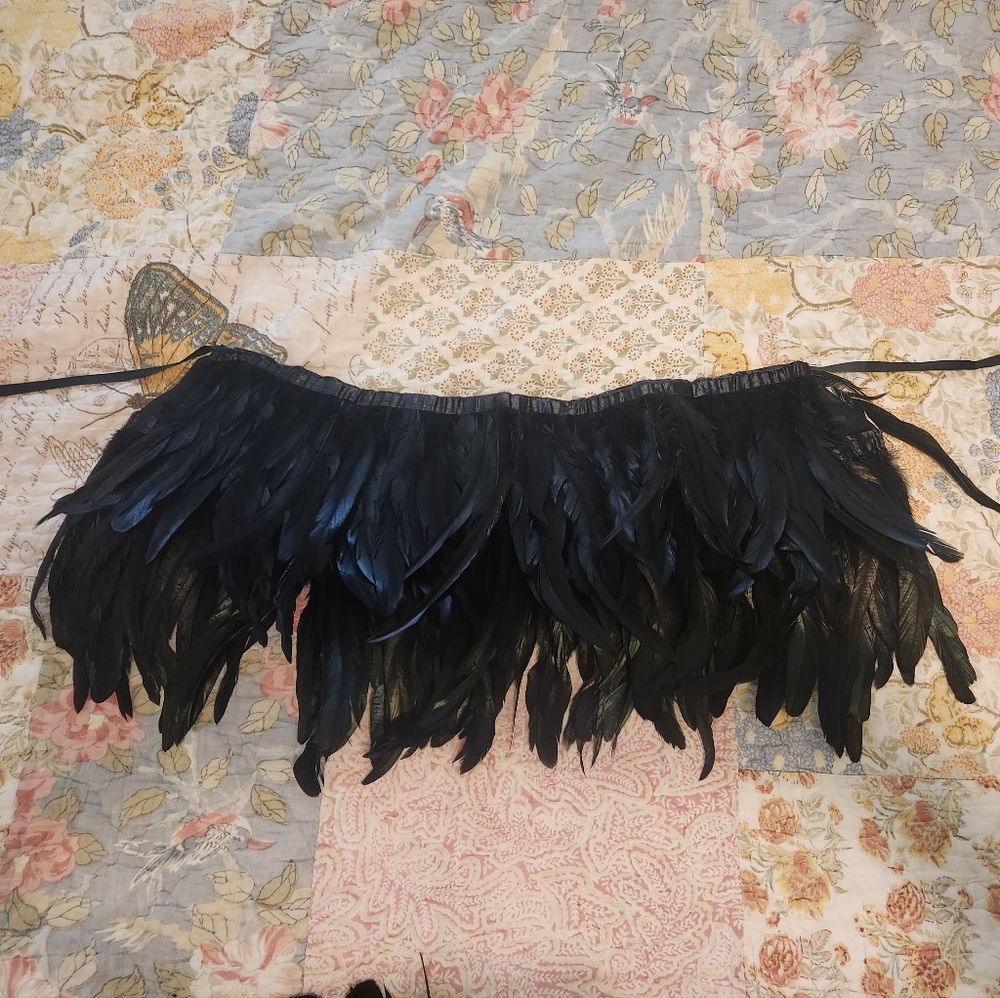 Tie in back feather skirt and shoulder or thigh wrap around feathers.